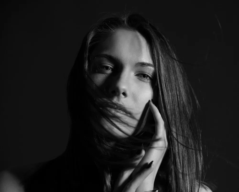 Portrait of a beautiful brunette woman with natural, makeup-free skin, showcasing smooth, radiant complexion—ideal example of results from professional chemical peels at PeaceLoveTox in Chagrin Falls, OH